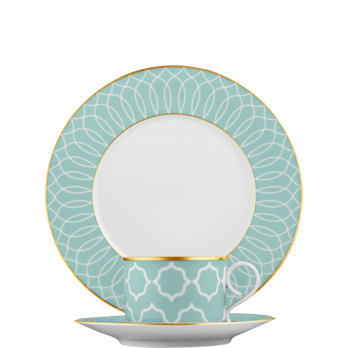 Teller, Tasse und Untertasse mit türkis-goldenem Muster auf weißem Hintergrund. Fürstenberg Porzellan.