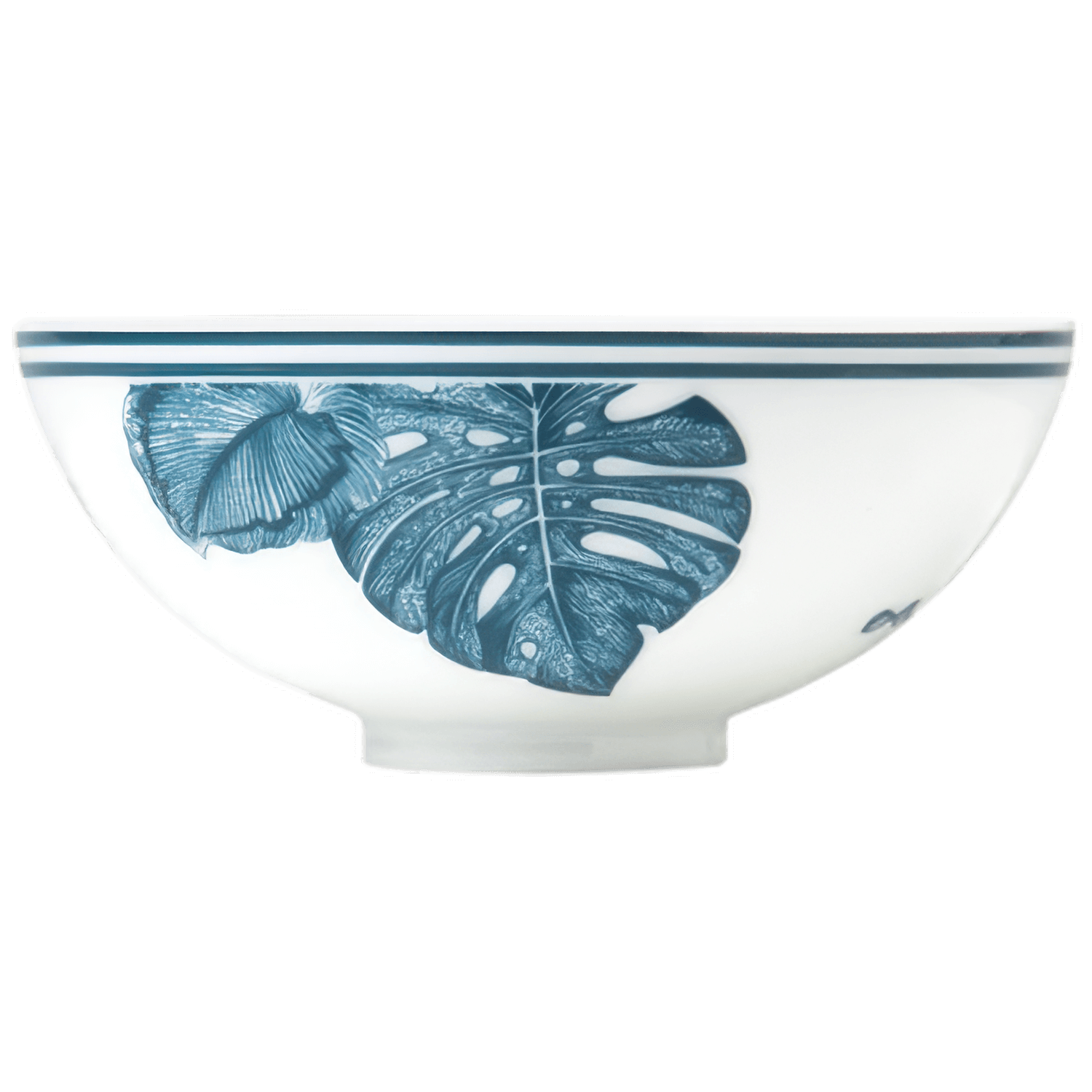 Weiße Porzellanschale mit blauem Monstera-Blatt-Motiv, steht still. Fürstenberg Porzellan.